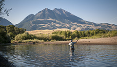 A man fishes in a Montana lake