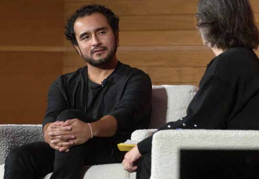 Javier Zamora is pictured in conversation with MSU President Cruzado.