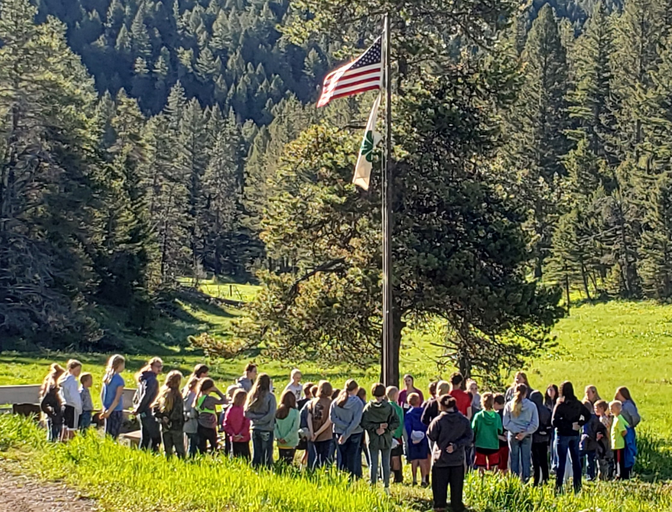 4-H members saying pledge to American Flag JR Camp 2022