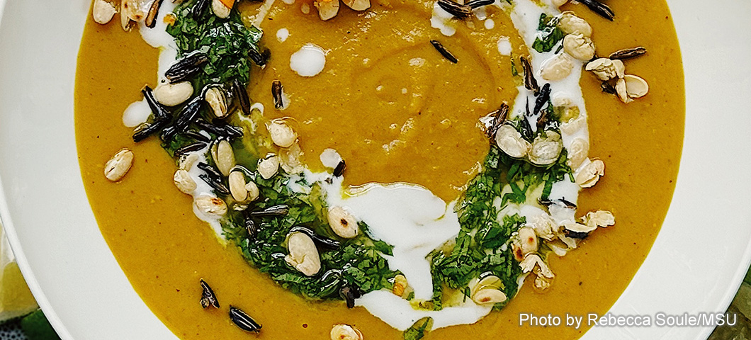 curried butternut squash and tepary bean soup in a bowl