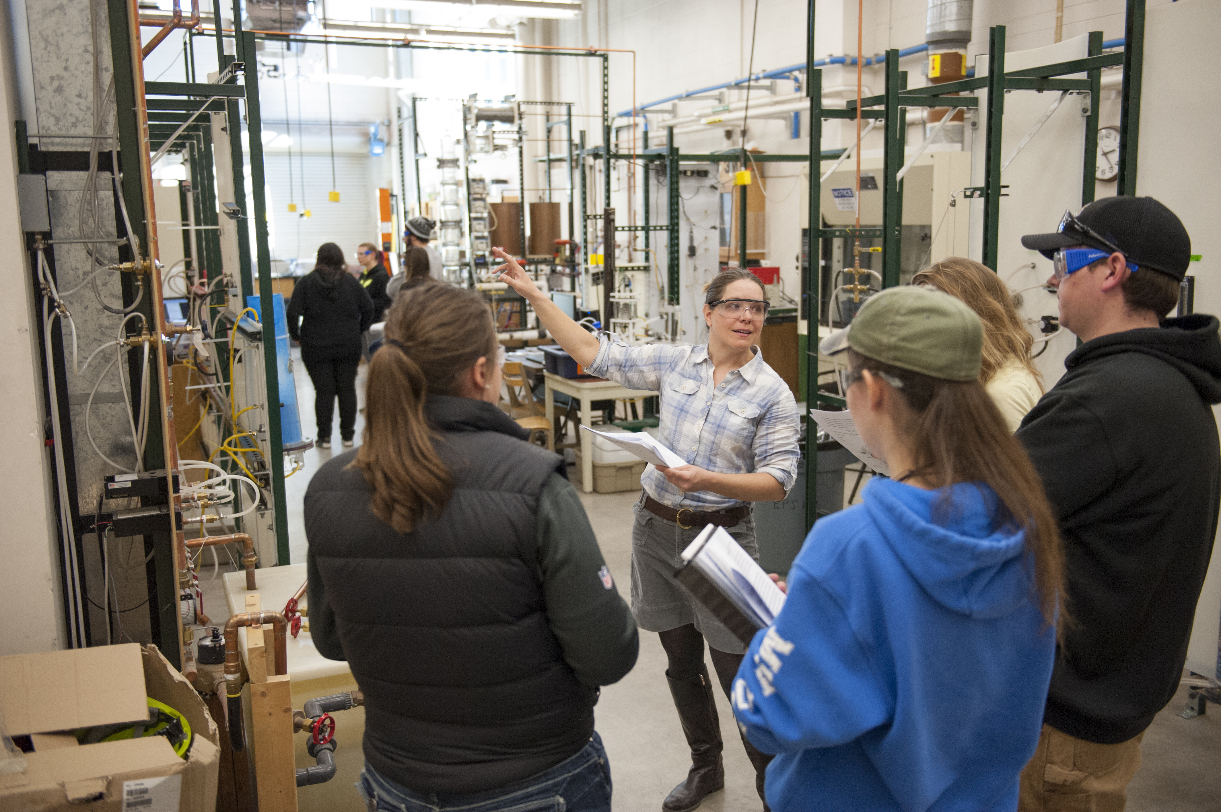 Faculty Abbie Richards showing student equipment