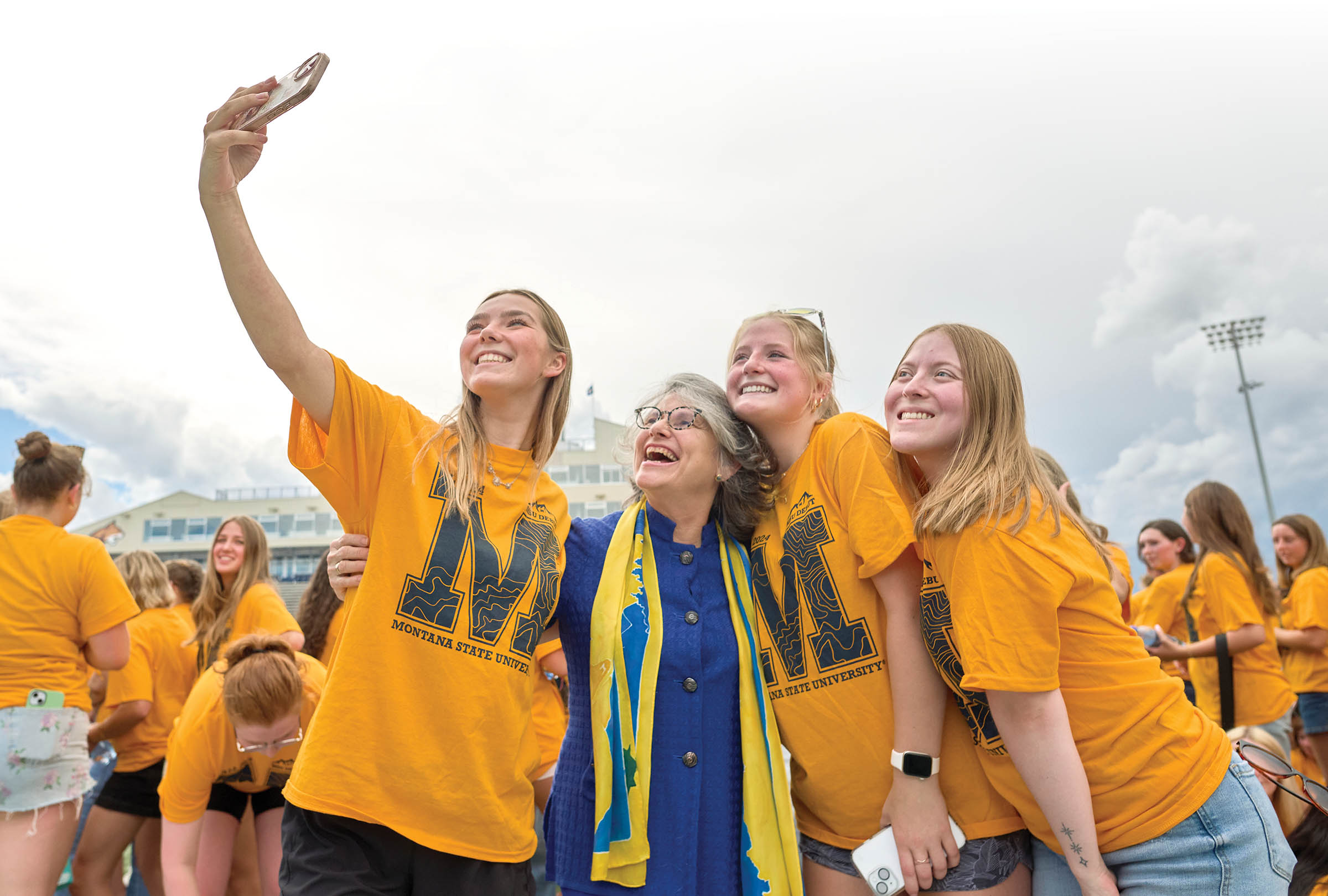 MSU President Waded Cruzado poses for a selfie with MSU students.